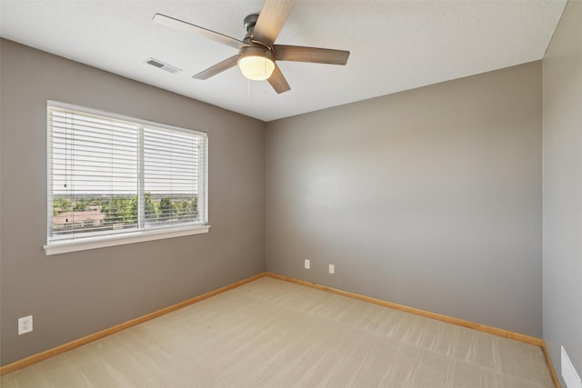 7039 Carey Ct, Johnston, IA 50131 - unfurnished room with light carpet and a ceiling fan