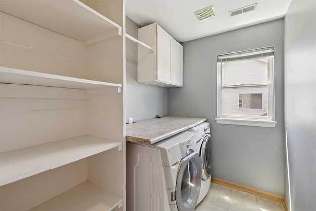 7039 Carey Ct, Johnston, IA 50131 - laundry area featuring cabinet space and washing machine and dryer