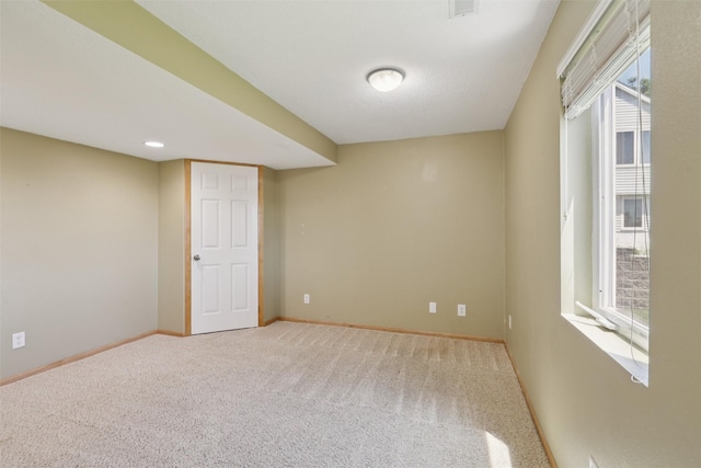 7039 Carey Ct, Johnston, IA 50131 - empty room featuring healthy amount of natural light and carpet flooring