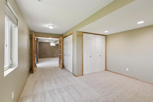 7039 Carey Ct, Johnston, IA 50131 - hall with carpet and recessed lighting