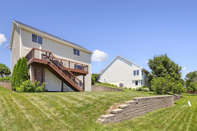 7039 Carey Ct, Johnston, IA 50131 - rear view of property with stairway, a wooden deck, and a lawn