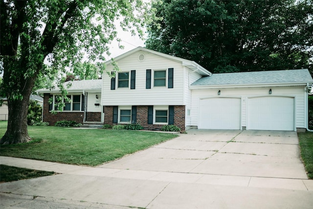 205 E 23rd St N, Newton, IA 50208 - tri-level home featuring an attached garage, brick siding, driveway, and a front yard