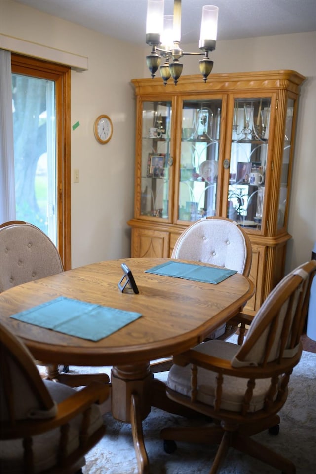 205 E 23rd St N, Newton, IA 50208 - carpeted dining room with a chandelier