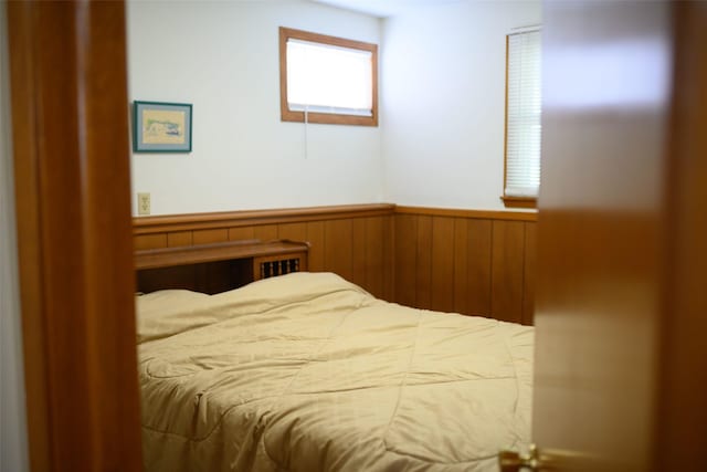 205 E 23rd St N, Newton, IA 50208 - bedroom featuring wainscoting