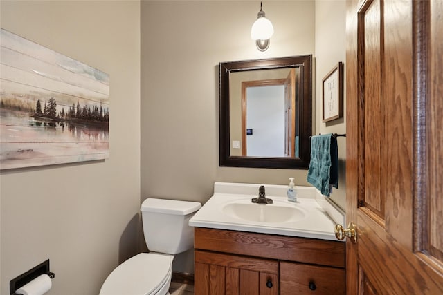 940 High Ave, Newton, IA 50208 - bathroom featuring vanity and toilet