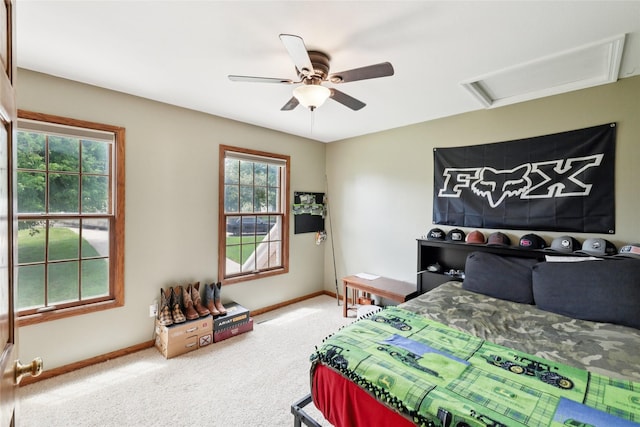 940 High Ave, Newton, IA 50208 - carpeted bedroom featuring attic access and ceiling fan