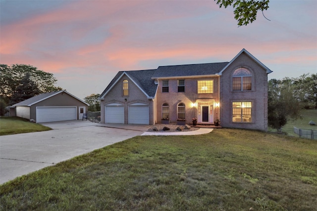 940 High Ave, Newton, IA 50208 - view of front of property featuring a garage, a front yard, and concrete driveway