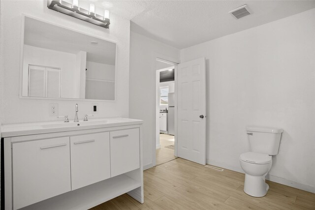 707 Bromley St, Marshalltown, IA 50158 - bathroom featuring wood finished floors and vanity