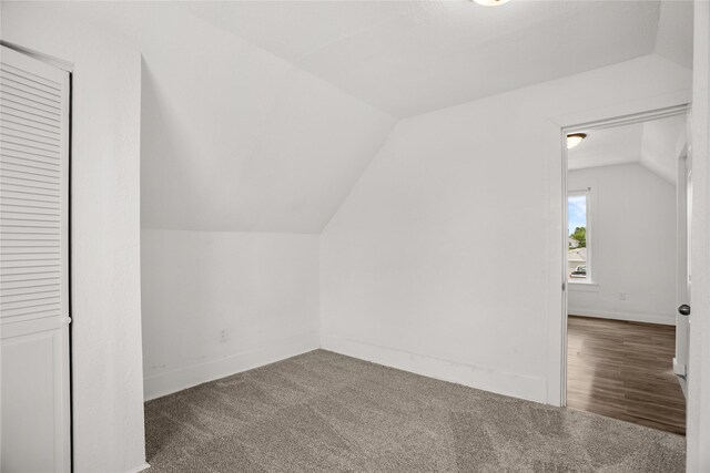 707 Bromley St, Marshalltown, IA 50158 - additional living space with vaulted ceiling and carpet