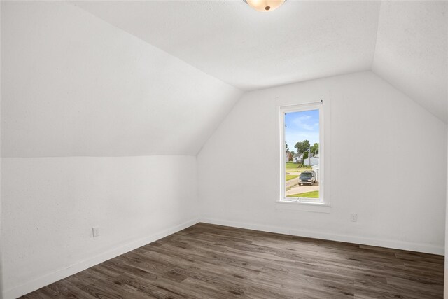 707 Bromley St, Marshalltown, IA 50158 - bonus room featuring lofted ceiling and dark wood finished floors