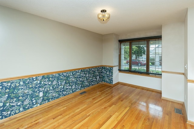 1560 Castlegar Ct, Pleasant Hill, IA 50327 - empty room with baseboards and wood finished floors