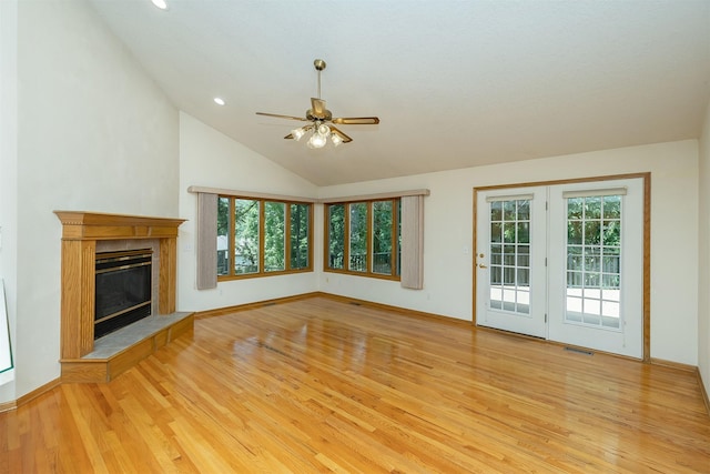 1560 Castlegar Ct, Pleasant Hill, IA 50327 - unfurnished living room featuring light wood-style flooring, a ceiling fan, lofted ceiling, a premium fireplace, and recessed lighting