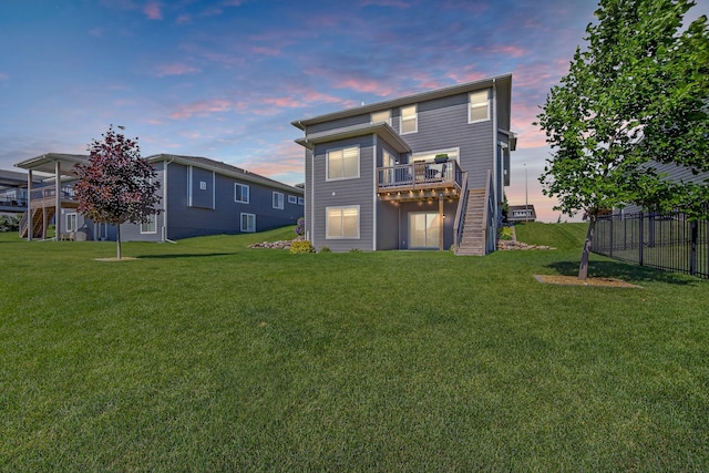 5519 165th St, Urbandale, IA 50323 - back of property with stairway and a wooden deck