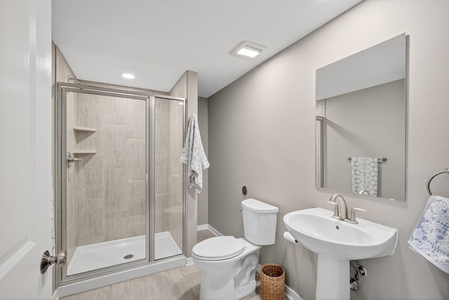 5519 165th St, Urbandale, IA 50323 - full bathroom with a stall shower and wood finished floors