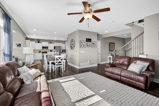 5519 165th St, Urbandale, IA 50323 - living room with a ceiling fan, dark wood-style flooring, stairs, and recessed lighting
