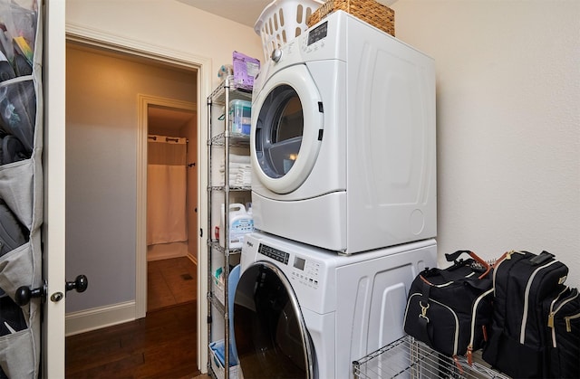 358 S 85th St, West Des Moines, IA 50266 - laundry area with stacked washer / dryer and wood finished floors