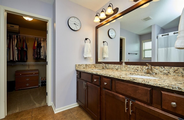 358 S 85th St, West Des Moines, IA 50266 - full bath featuring double vanity, tile patterned flooring, and a spacious closet