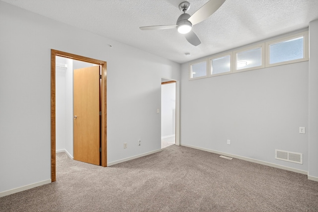 640 S 50th St Unit 2204, West Des Moines, IA 50265 - carpeted spare room featuring ceiling fan and a textured ceiling
