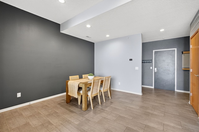 640 S 50th St Unit 2204, West Des Moines, IA 50265 - dining room with recessed lighting, light wood-style floors, and a textured ceiling