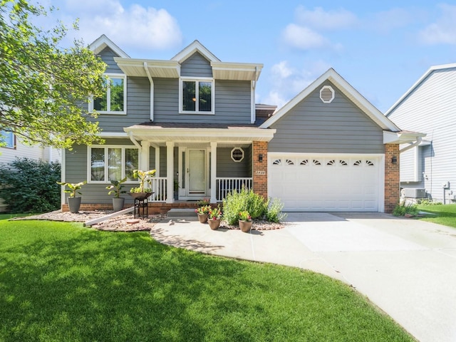 3436 Valley View Dr, West Des Moines, IA 50265 - traditional-style home featuring a garage, a porch, driveway, and a front yard