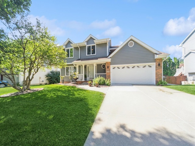 3436 Valley View Dr, West Des Moines, IA 50265 - view of front facade with an attached garage, covered porch, brick siding, and concrete driveway