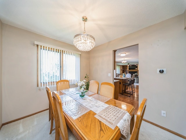 3436 Valley View Dr, West Des Moines, IA 50265 - dining room with a chandelier and light colored carpet