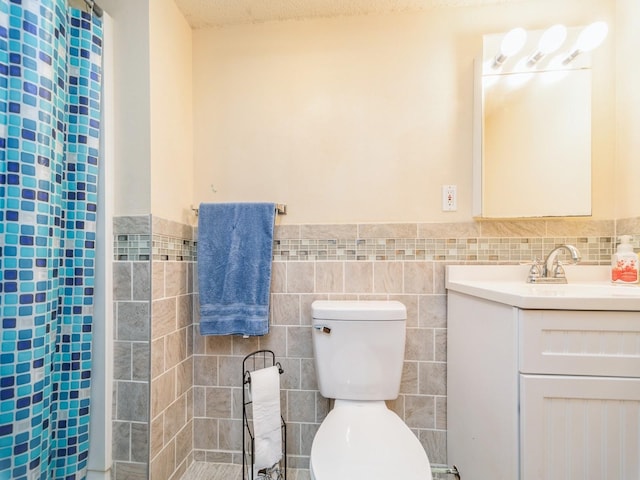 3436 Valley View Dr, West Des Moines, IA 50265 - full bath featuring tile walls, vanity, and wainscoting