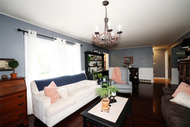 344 S 1st St, Ogden, IA 50212 - living room with a chandelier, wood finished floors, and ornamental molding