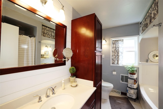 344 S 1st St, Ogden, IA 50212 - bathroom featuring vanity, a bath, and tile patterned floors