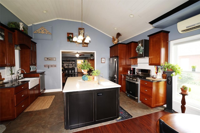 344 S 1st St, Ogden, IA 50212 - kitchen with appliances with stainless steel finishes, an AC wall unit, lofted ceiling, wall chimney exhaust hood, and a chandelier