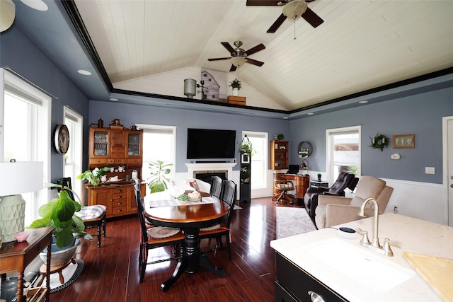 344 S 1st St, Ogden, IA 50212 - dining space with wood ceiling, lofted ceiling, a ceiling fan, wainscoting, and dark wood-style flooring