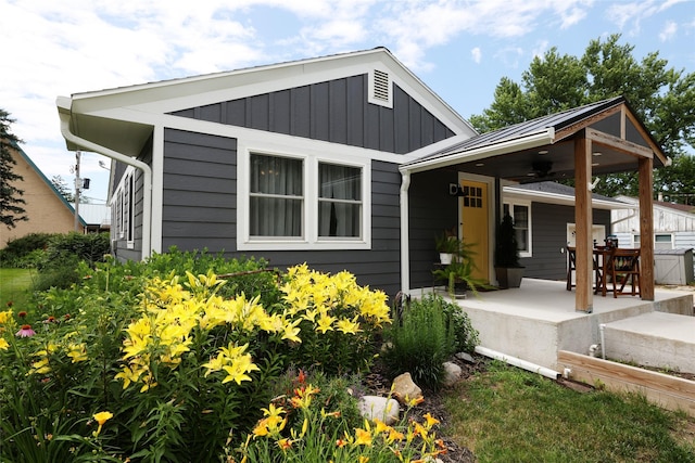 344 S 1st St, Ogden, IA 50212 - view of front facade featuring board and batten siding and covered porch