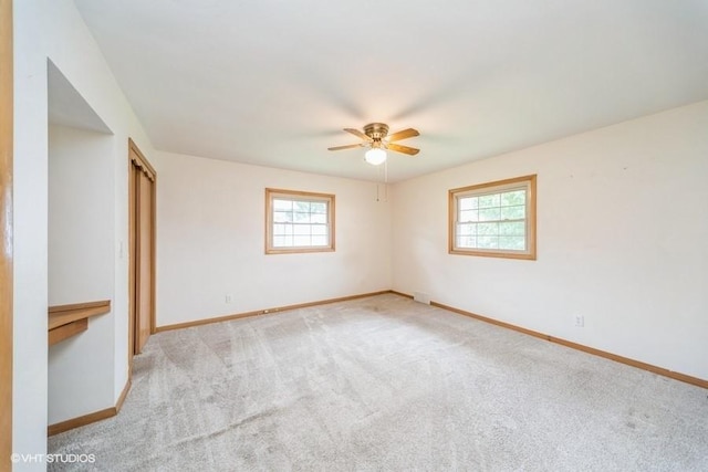 1805 Sycamore St, Granger, IA 50109 - carpeted empty room featuring plenty of natural light and a ceiling fan