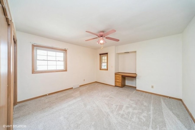 1805 Sycamore St, Granger, IA 50109 - unfurnished bedroom with carpet, built in study area, and ceiling fan