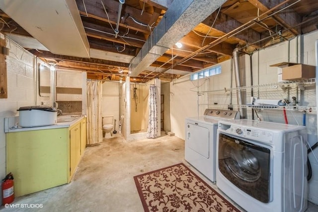 1805 Sycamore St, Granger, IA 50109 - unfinished below grade area with washer and dryer and a sink