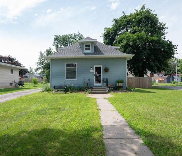 210 3rd St NE, Mitchellville, IA 50169 - bungalow-style home featuring a shingled roof