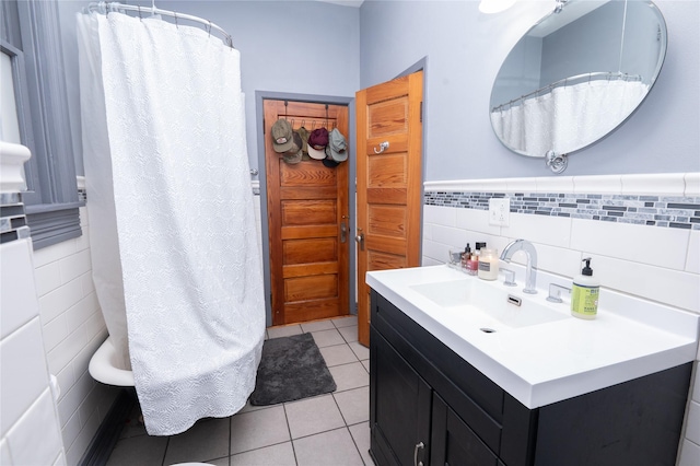 210 3rd St NE, Mitchellville, IA 50169 - bathroom featuring tile walls, tile patterned flooring, vanity, a wainscoted wall, and a shower with shower curtain