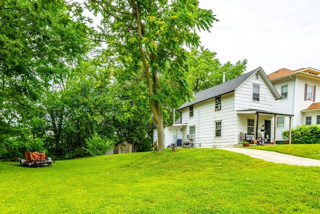 1054 14th St, Des Moines, IA 50314 - view of green lawn with a storage shed