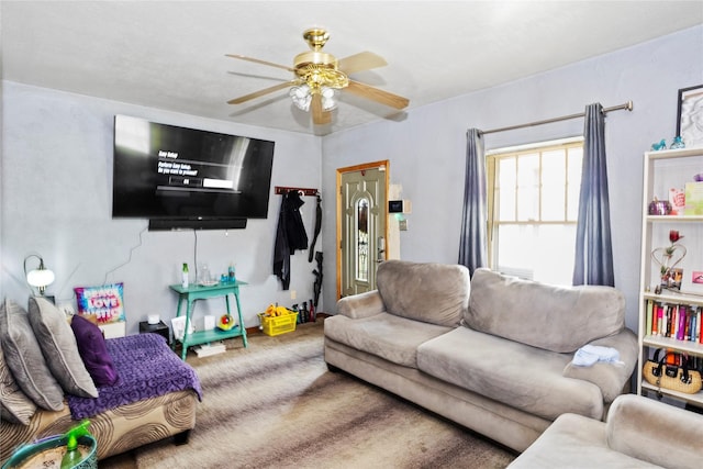 1054 14th St, Des Moines, IA 50314 - carpeted living area with a ceiling fan