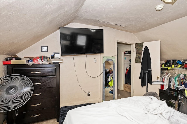 1054 14th St, Des Moines, IA 50314 - bedroom with vaulted ceiling and a textured ceiling