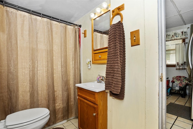 1054 14th St, Des Moines, IA 50314 - bathroom with tile patterned floors, vanity, and a shower with curtain