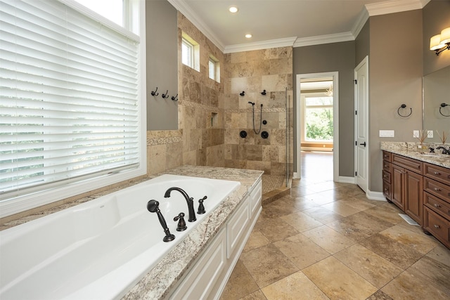 4701 150th St, Urbandale, IA 50323 - bathroom with vanity, a garden tub, a tile shower, crown molding, and recessed lighting