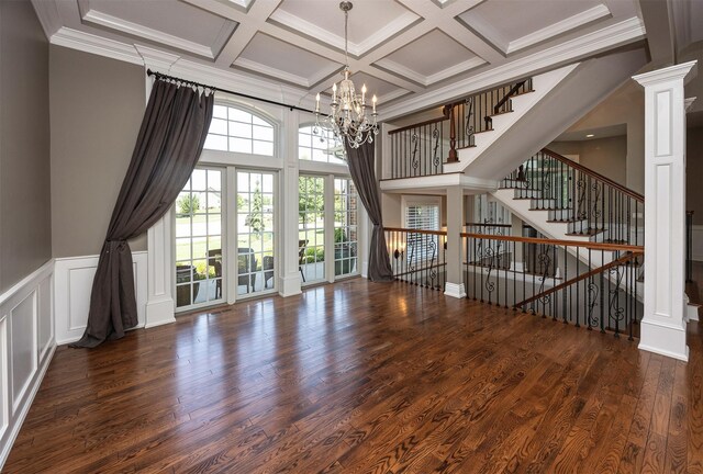 4701 150th St, Urbandale, IA 50323 - unfurnished living room with a chandelier, coffered ceiling, stairway, beam ceiling, and wood finished floors