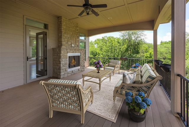 4701 150th St, Urbandale, IA 50323 - wooden deck with an outdoor living space with a fireplace and a ceiling fan