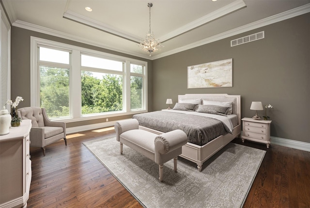 4701 150th St, Urbandale, IA 50323 - bedroom with a tray ceiling, dark wood finished floors, a chandelier, crown molding, and recessed lighting