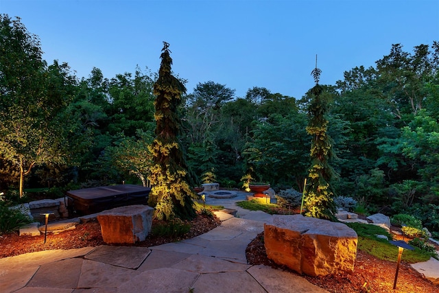 4701 150th St, Urbandale, IA 50323 - view of patio featuring a fire pit