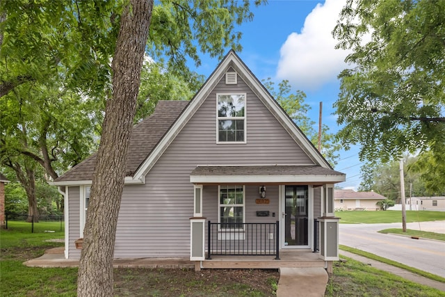 402 S 11th St, Adel, IA 50003 - view of front of property featuring a porch and a shingled roof
