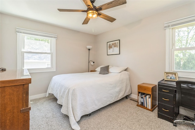 311 W 15th St N, Newton, IA 50208 - bedroom featuring light colored carpet and ceiling fan