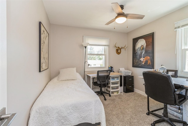 311 W 15th St N, Newton, IA 50208 - bedroom with an office area, light colored carpet, and ceiling fan