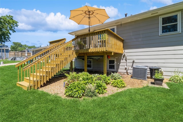 311 W 15th St N, Newton, IA 50208 - rear view of property with a wooden deck, a lawn, and stairway